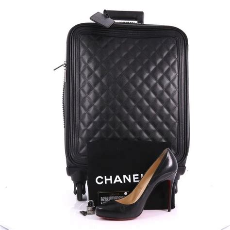 chanel trolley rolling suitcase|Chanel coco rolling case.